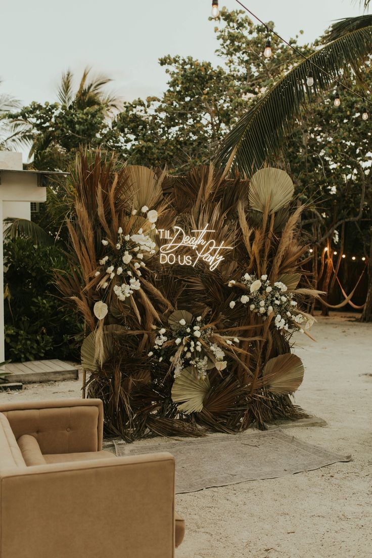 an outdoor seating area with chairs and flowers