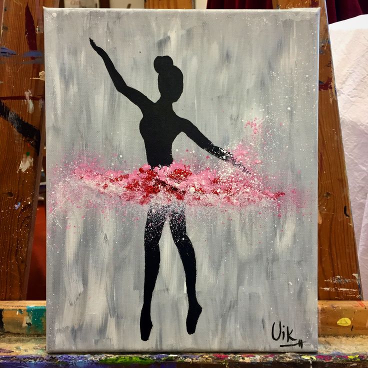 a painting of a woman holding a pink ribbon in front of a wooden wall with paint splattered on it