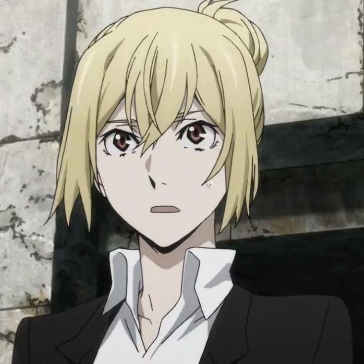 an anime character with blonde hair wearing a black suit and white shirt, staring at the camera