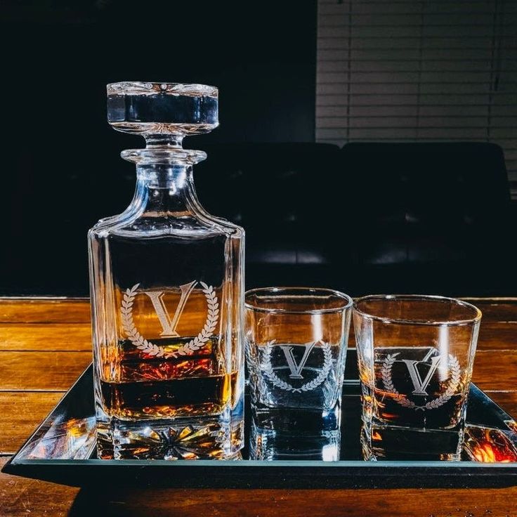 two glasses and a decanter on a tray