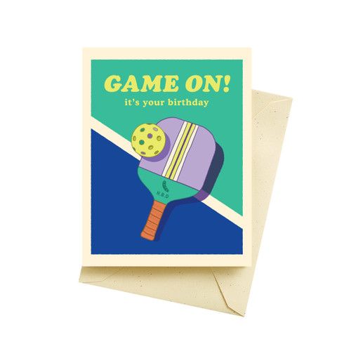 a card with a ping pong paddle on it that says game on, it's your birthday