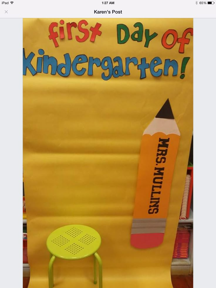 an image of a school bulletin board with a yellow chair and pencils on it