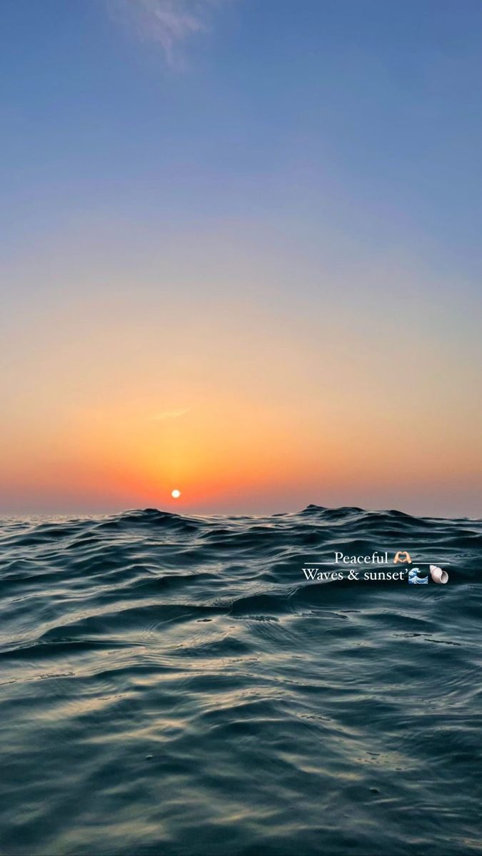 the sun is setting over the ocean as it reflects in the water's surface