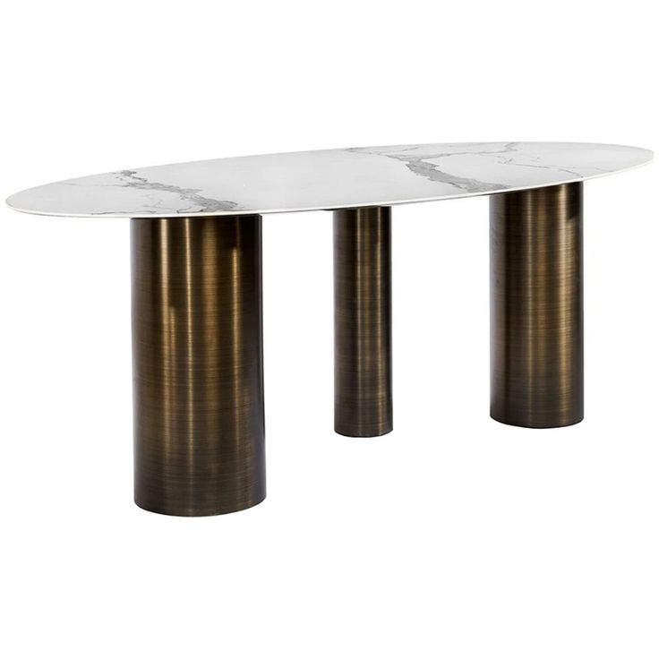 an oval marble table with two metal pillars in the middle and white marble on top