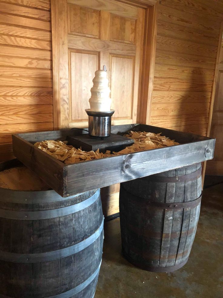 two wooden barrels sitting next to each other