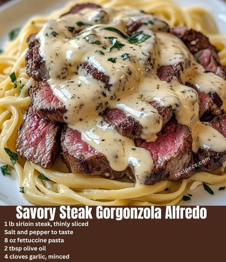 steak with gravy on top of noodles and sauce in a white plate, labeled savory steak gorgonzoza alfredo & alfredo