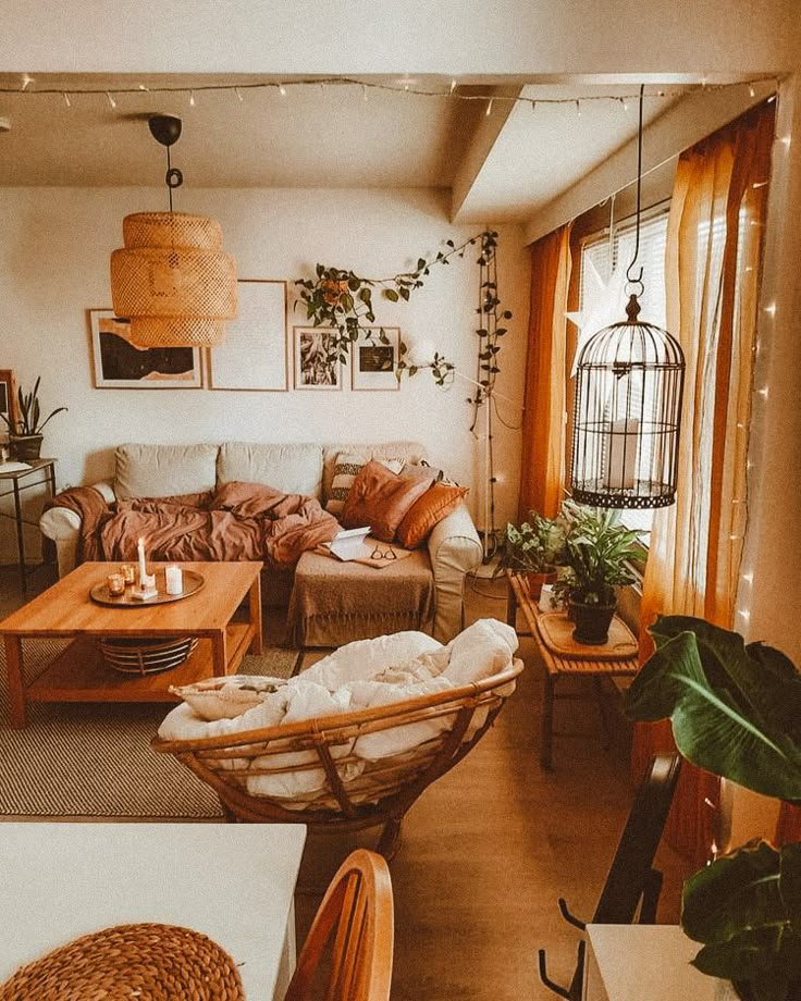 a living room filled with furniture and plants