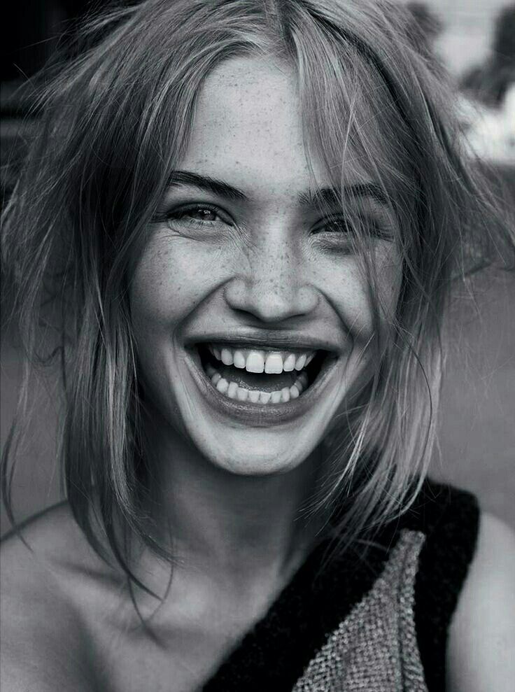 black and white photograph of a smiling woman