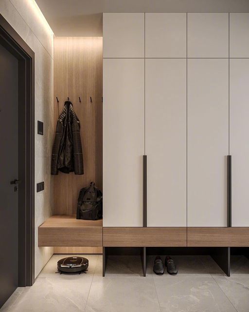 a white and wood closet with shoes on the floor