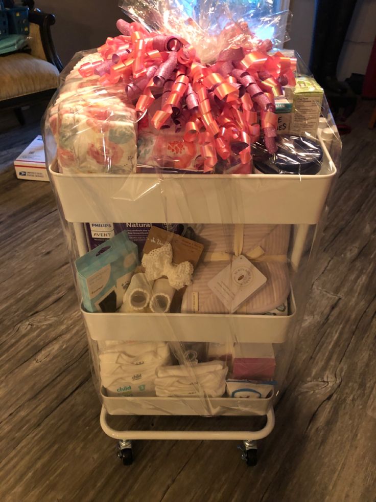 a cart filled with lots of items on top of a wooden floor