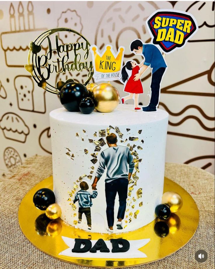 a birthday cake with an image of a dad and son on it