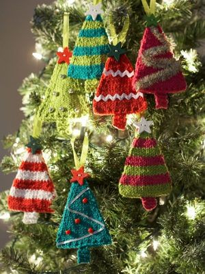 crocheted christmas ornaments hanging from a tree