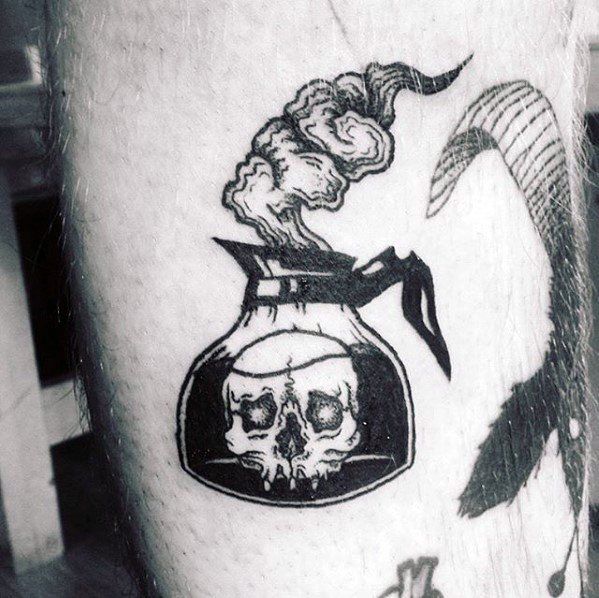 a man with a skull in a bottle tattoo on his leg