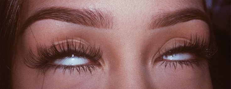 a woman's eyes with long false lashes