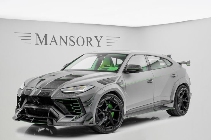 the new lamb urus suv is displayed in front of a sign that reads mansory