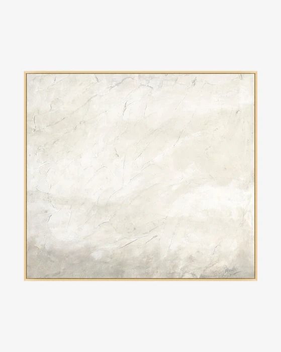 a white marble wall with a gold frame