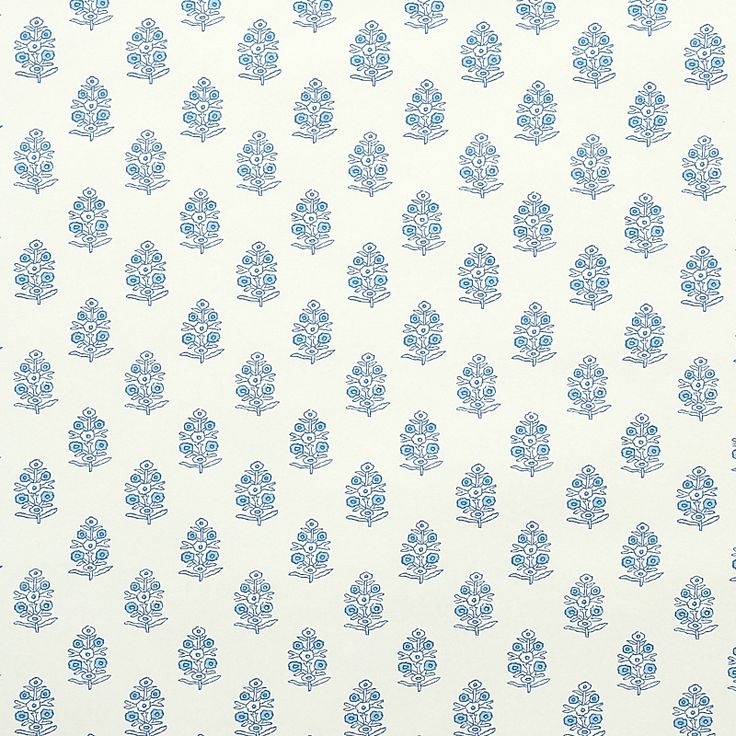 a blue and white wallpaper with small trees on the left side of the wall