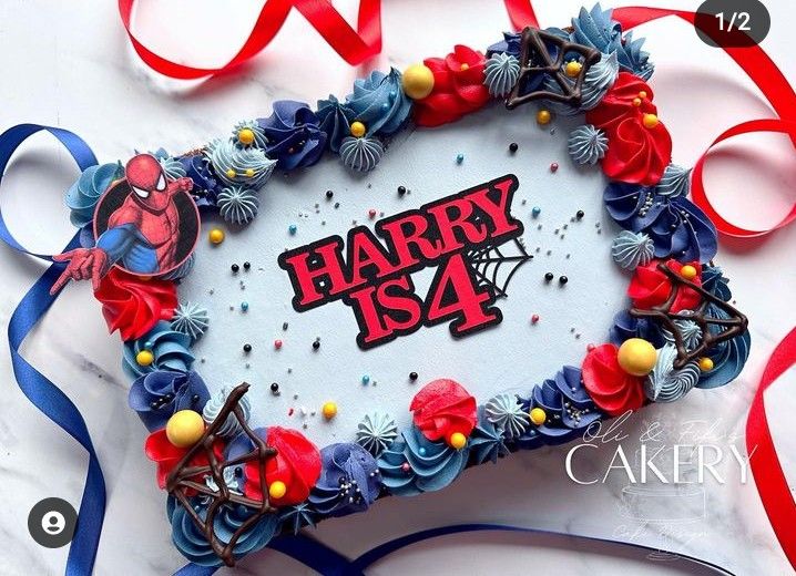 a birthday cake with the name harry is 4 surrounded by red, white and blue decorations