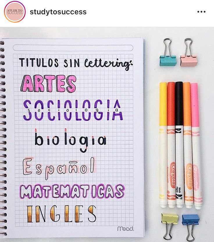 a notebook with some writing on it next to markers and pencils in different colors