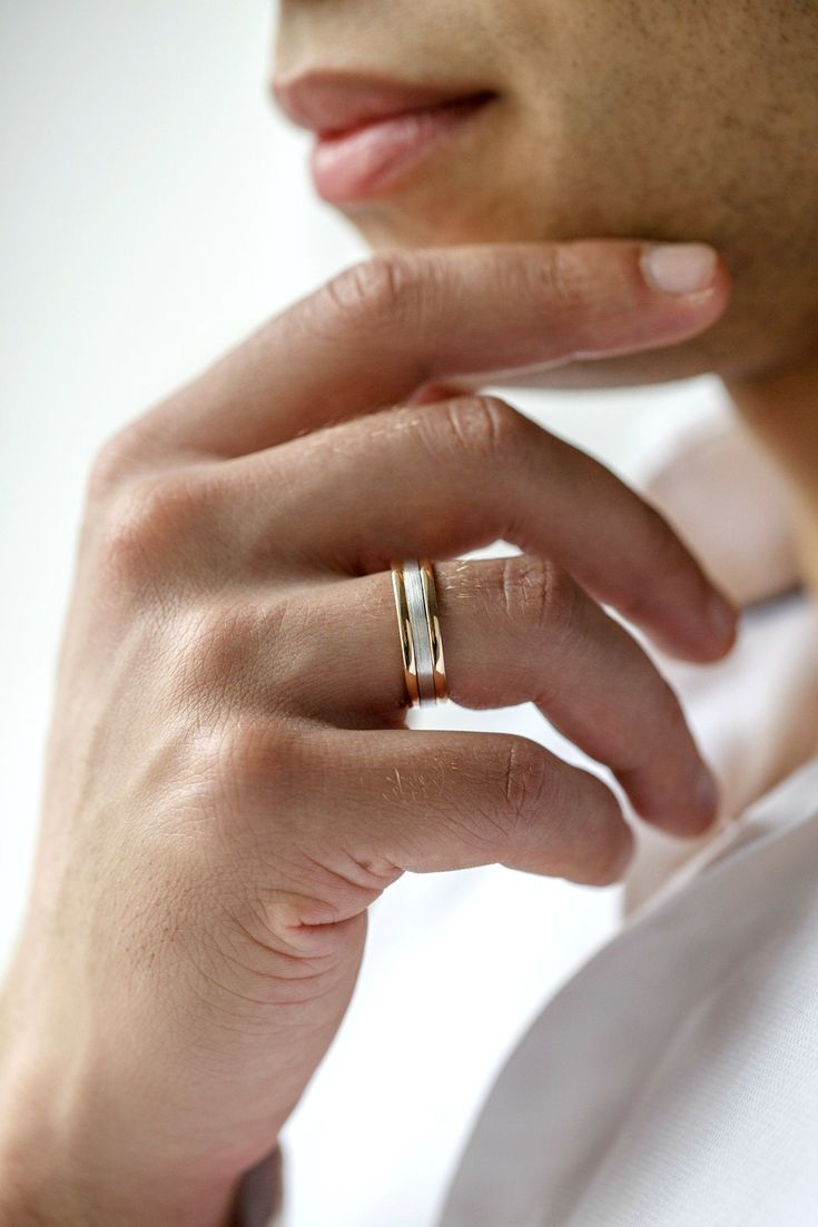 a close up of a person wearing a ring