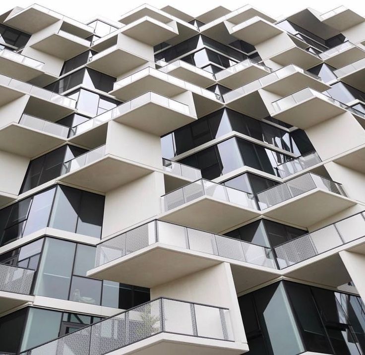 an apartment building with balconies and balconies on each floor