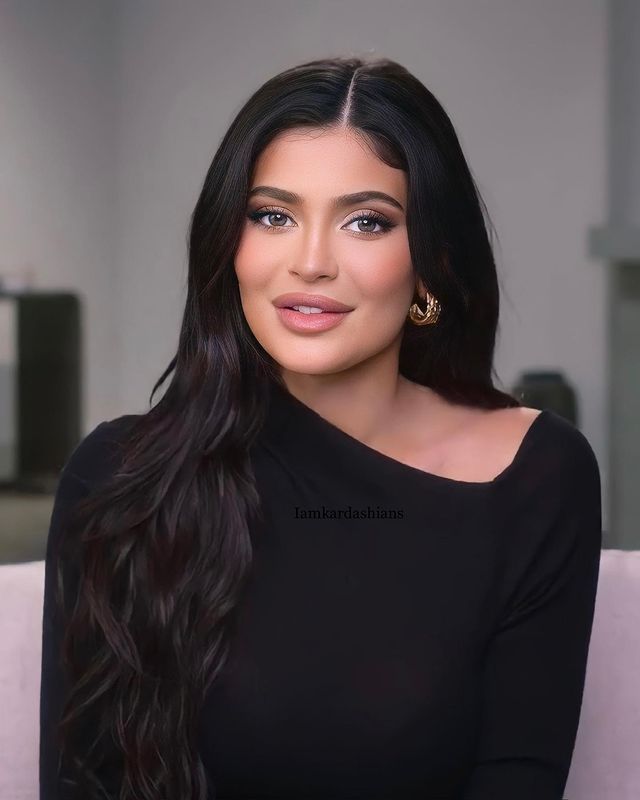 a woman sitting on top of a white couch