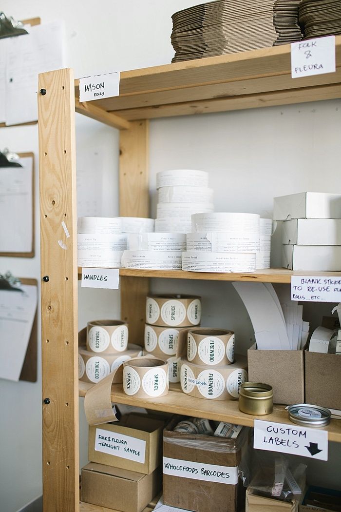 the shelves are filled with boxes and rolls of toilet paper