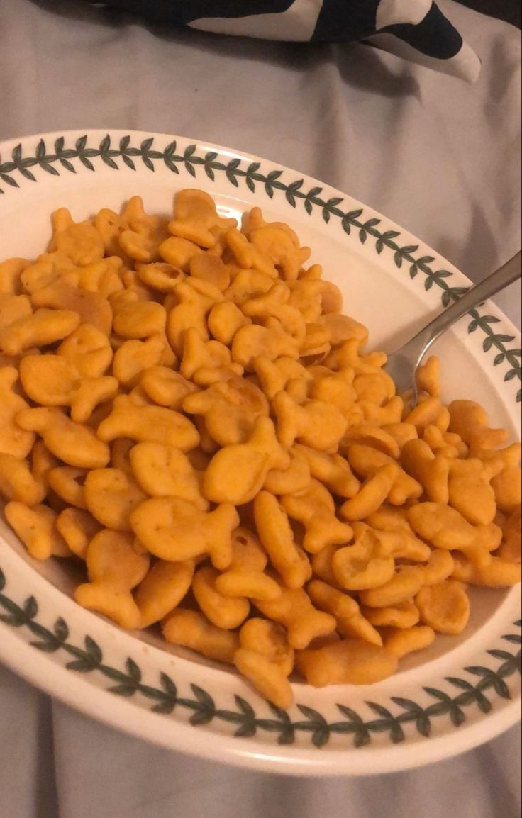 a white plate topped with cheetos on top of a table