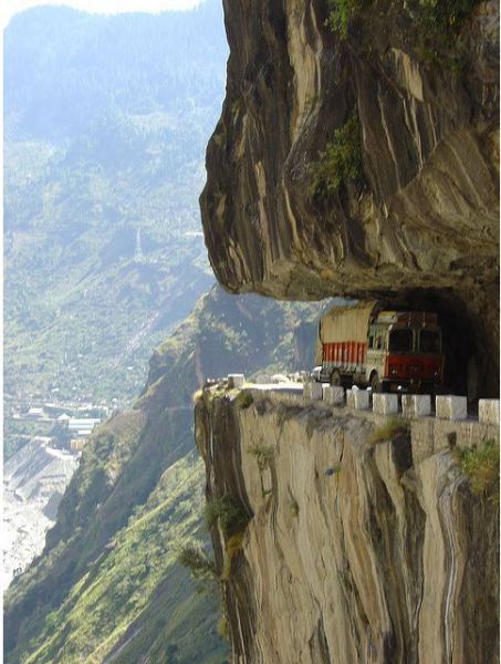 a truck driving down the side of a cliff