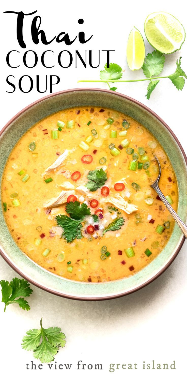 thai coconut soup in a bowl with limes and cilantro on the side