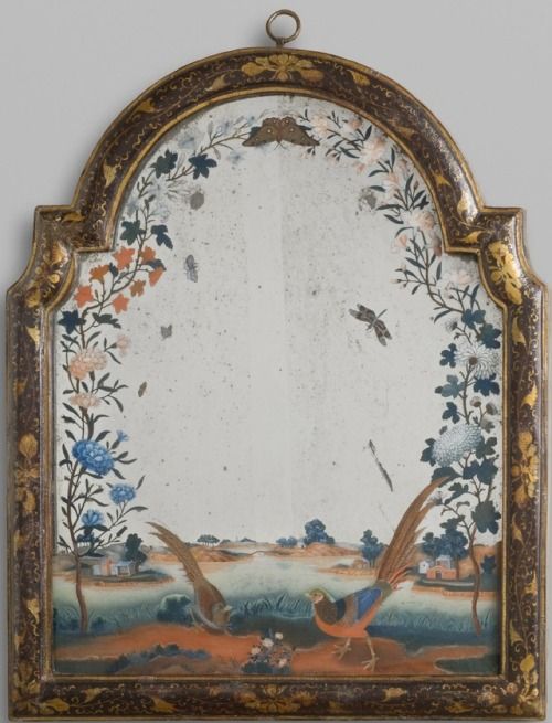 an ornately decorated wall hanging with birds and flowers