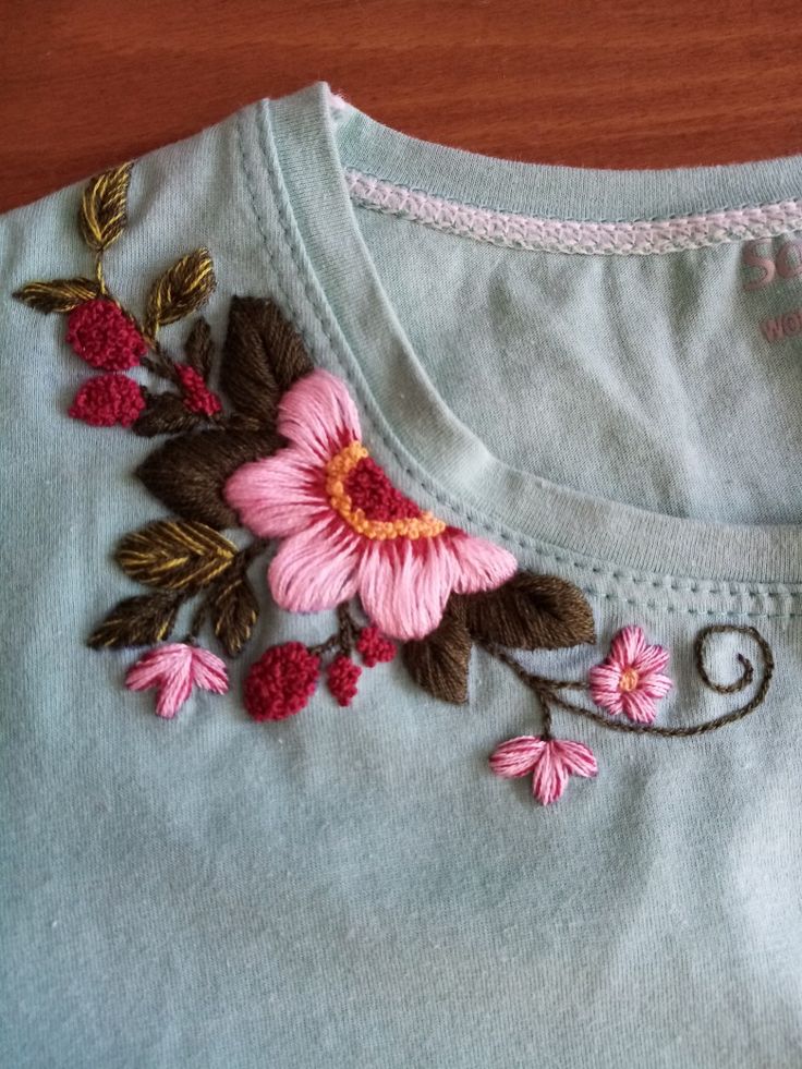 Embroidery|flat embroidery on T-shirts Floral Embroidery Tshirt, Knitting Embroidery Pattern, Shirt Hand Embroidery Design, Flower Bud Embroidery, Hand Embroidery Tshirt Ideas, Embroidery Designs For T Shirts, Embroidery T Shirt Ideas, Shoulder Embroidery Designs, Embroidery Designs On Tshirt