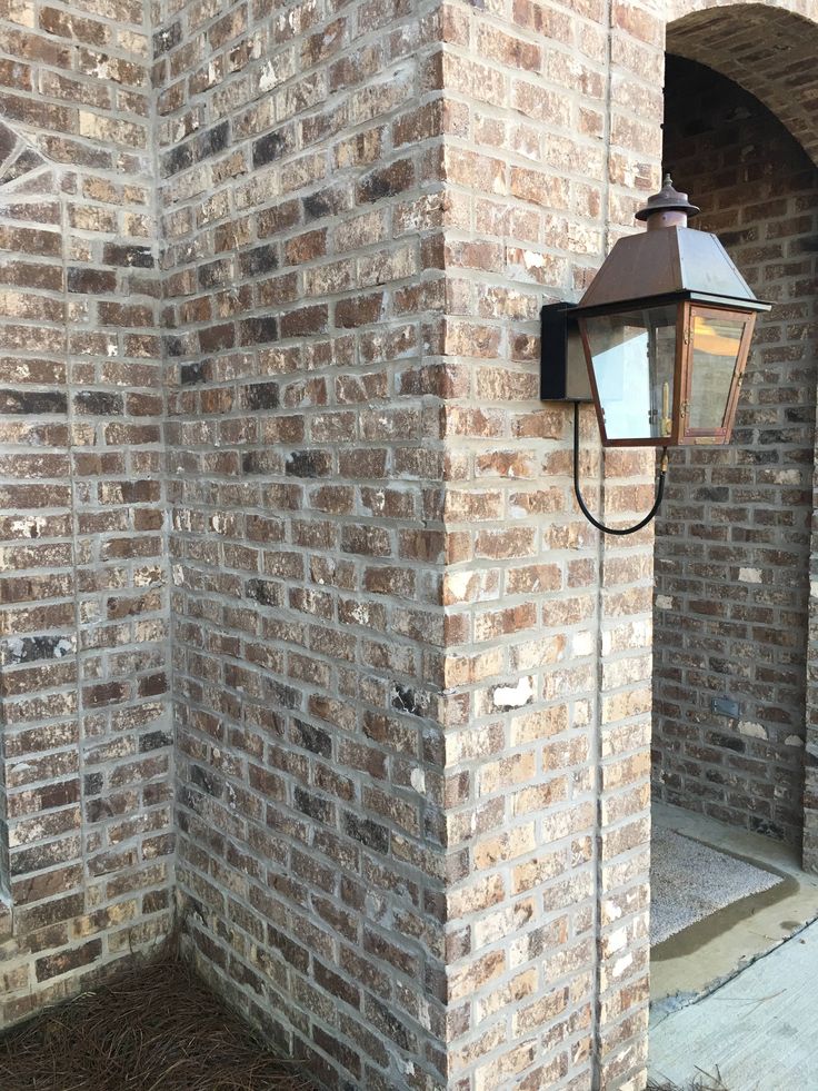 a brick wall with a light on it