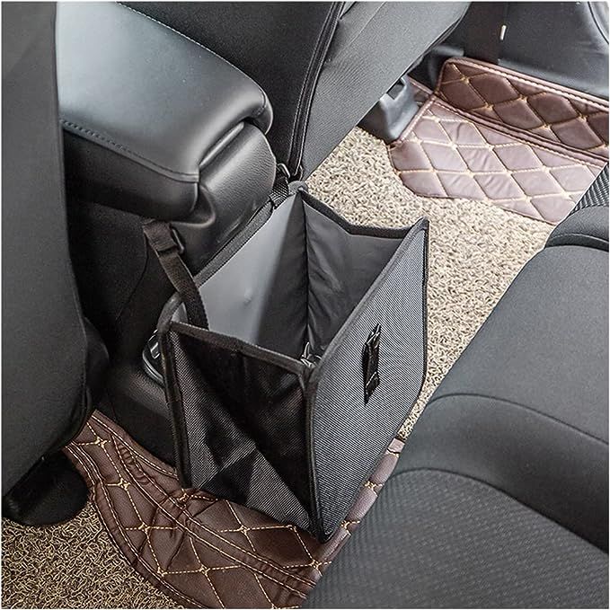 the interior of a car with two seats and one has an open back seat pocket