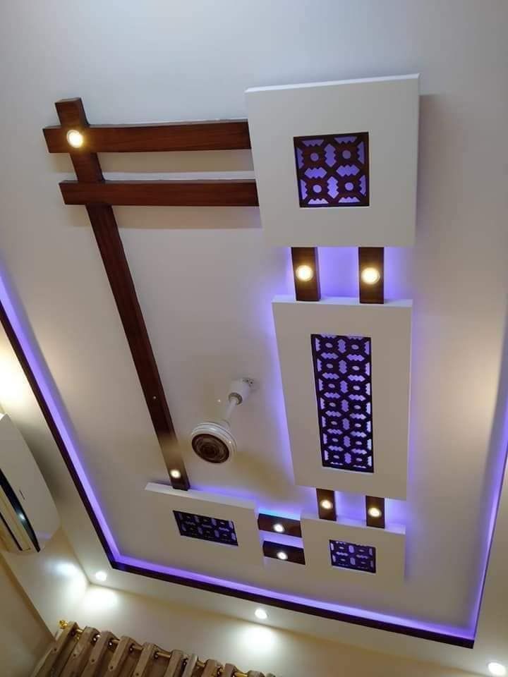 an overhead view of a living room with lights on the ceiling and decorative lighting above it