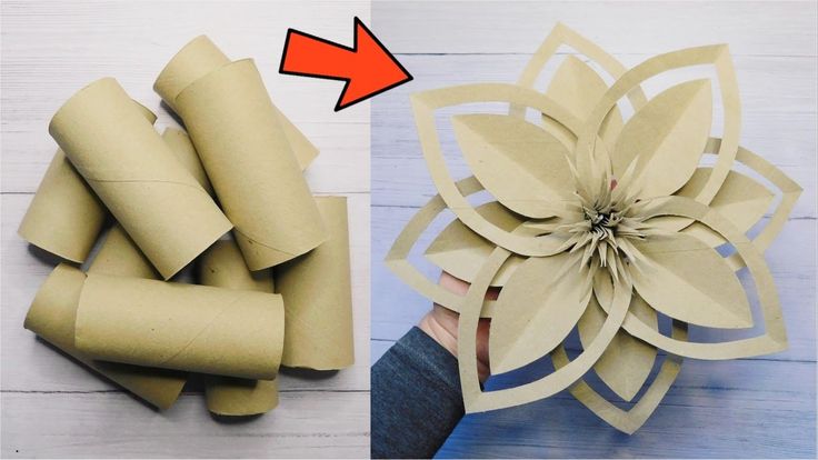 an origami flower being made out of toilet paper