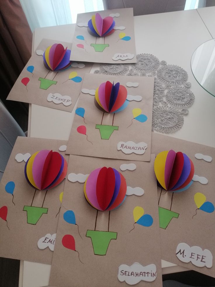 several cards with hot air balloons on them sitting on a table next to each other