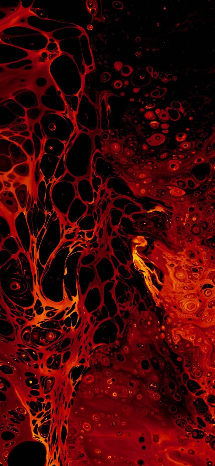 an abstract red and black background with lots of bubbles on the surface, like fire or ice