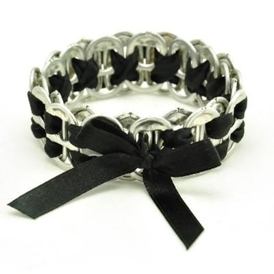 a black and silver bracelet with a bow