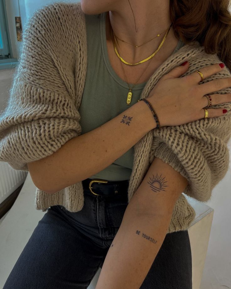 a woman with a tattoo on her arm