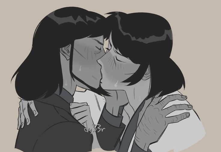 two people that are kissing each other in front of a gray and white background with black hair