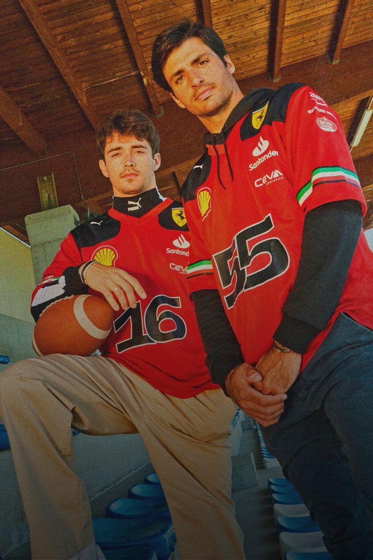 two men in red jerseys posing for a photo