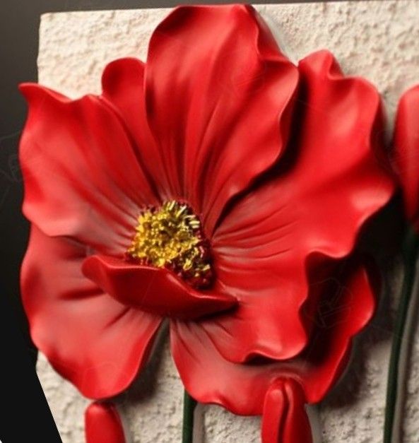 two red flowers on a white brick wall