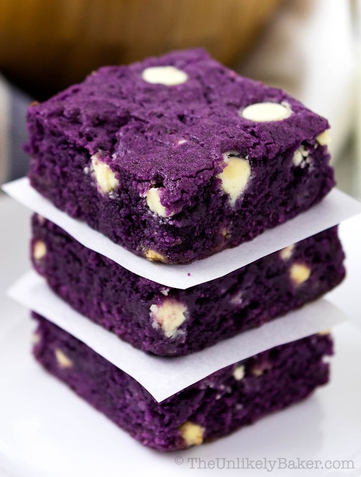 three purple brownies stacked on top of each other