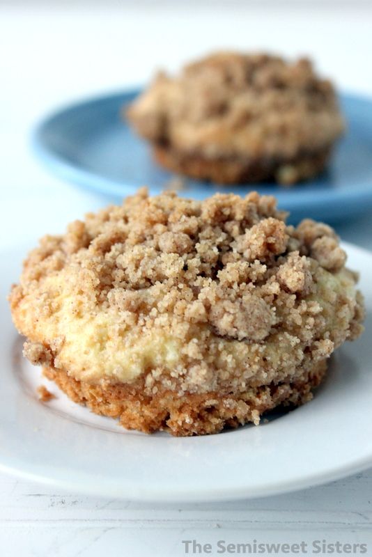 two cookies are sitting on a plate with crumbs in the middle and one has an oatmeal topping