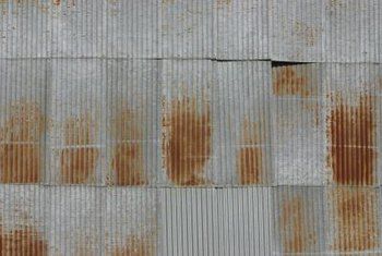 rusted corrugated roof with brown spots on it