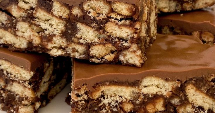 several pieces of chocolate chip cookie bars stacked on top of each other