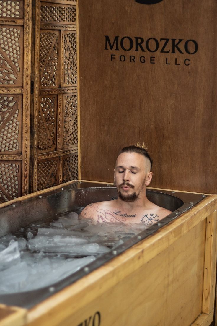 a man is sitting in the hot tub