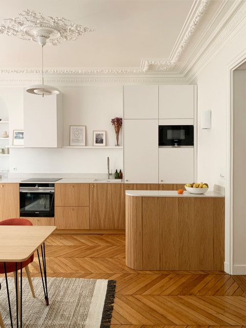 the kitchen is clean and ready to be used for dinner or lunch time, as well as dining room furniture