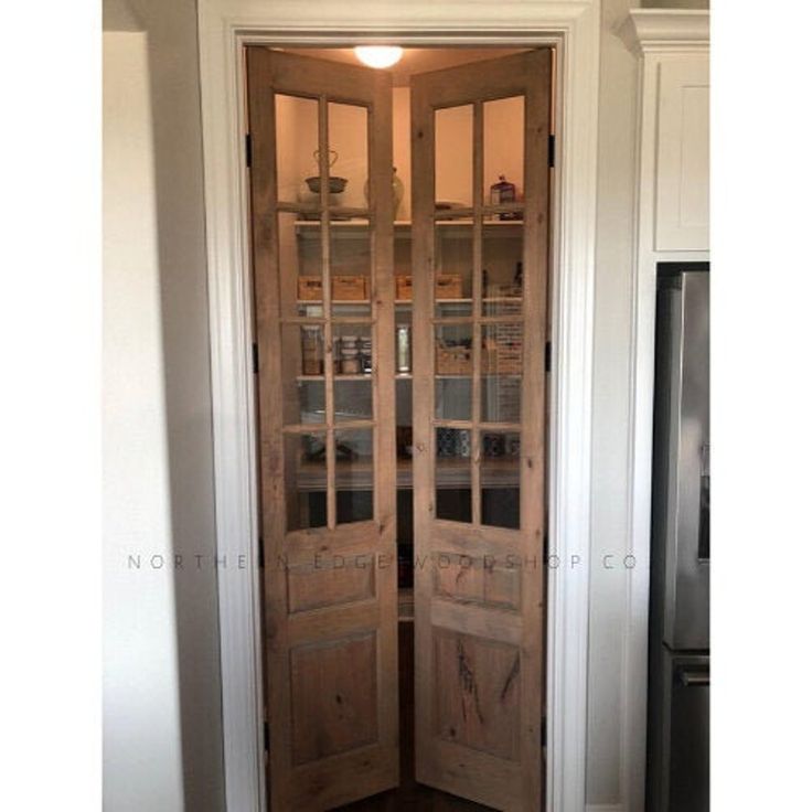 an open wooden door in a kitchen